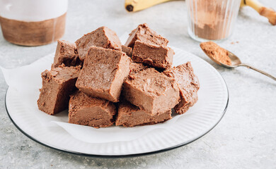 Raw vegan chocolate fudge. Healthy vegan food concept.
