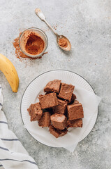 Raw vegan chocolate fudge. Healthy vegan food concept.