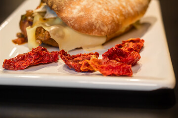 grilled chicken sandwich and dry tomatoes 