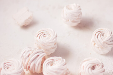 Homemade russian zephyr made of apples, raspberry and blackberry on the dark grey concrete background. Free copy space. White marshmallow