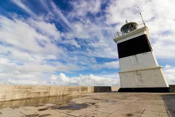 Foto op Canvas View of the Grade II Listed Holyhead Breakwater Lighthouse with a striking sky behind © Liberty Photo Art
