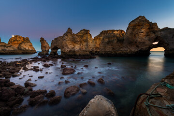 Fototapeta premium View of the beautiful rock formations at the Ponta da Piedade, near the city of Lagos, Algarve, at dusk; Concept for travel in Portugal