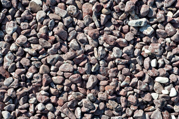 Drainage systems from small pebbles. Garden drainage for plants and trees. Red stones for roads and flower beds.