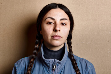 girl with pigtails and blue jacket