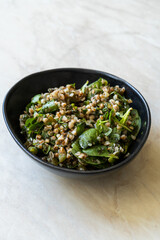 Healthy Organic Fresh Purslane Salad with Buckwheat and Pickle.