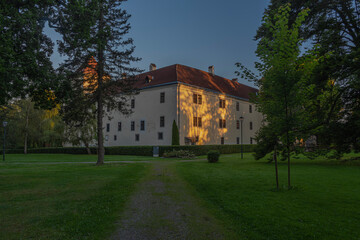 Fototapeta na wymiar Gmund castle and buildings in summer orange morning