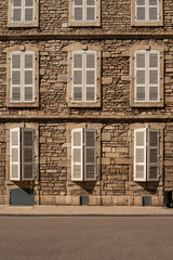 Fototapeta na wymiar A house in France and characteristic window shutters 