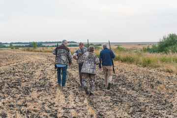 Group of hunters going on the hunting. Autumn season concept