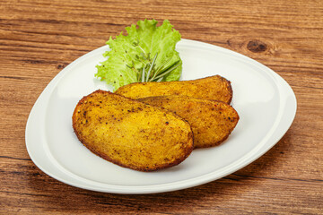 Baked potato with herbs and spices