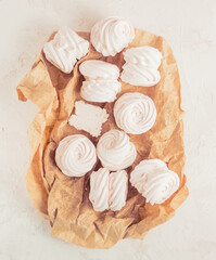 Homemade russian zephyr made of apples, raspberry and blackberry on white concrete background...