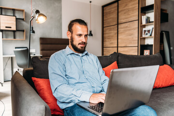 Young Businessman Working In A Modern Office. Man Working From Home.