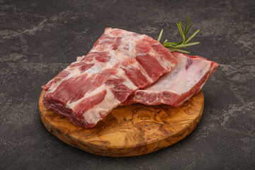 Raw pork ribs served rosemary
