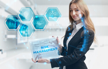 Business, Technology, Internet and network concept. Young businessman working on a virtual screen of the future and sees the inscription: Risk management