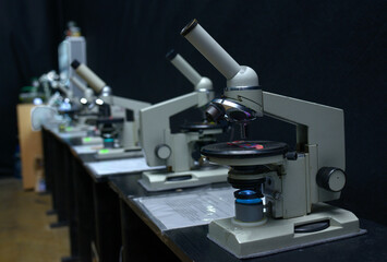 Fototapeta na wymiar Microscopes set on the worktable of the school lab