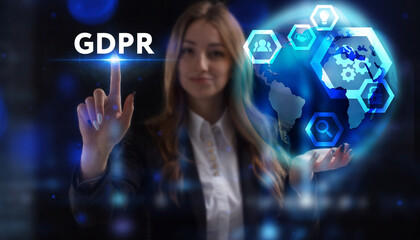 Business, Technology, Internet and network concept. Young businessman working on a virtual screen of the future and sees the inscription: GDPR