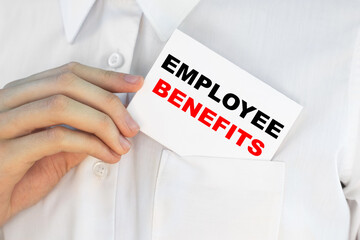 Businessman putting a card with text EMPLOYEE BENEFITS n the pocket