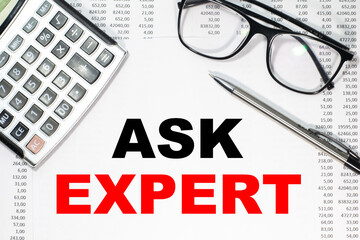 Business concept. Notebook with text ASK EXPERT sheet of white paper for notes, calculator, glasses, pencil, pen, in the white background
