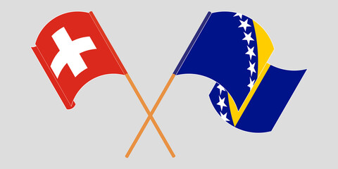 Crossed and waving flags of Switzerland and Bosnia and Herzegovina