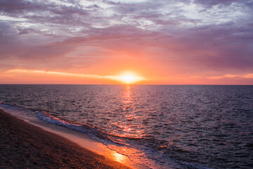 beautiful sunrise at sea with clouds