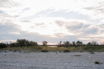 beautiful beach on the lake at sunset