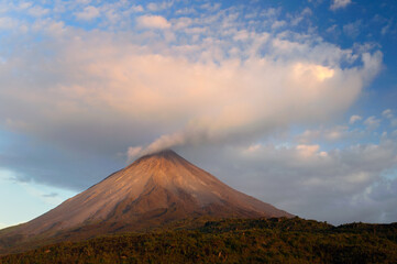 Cloud expanding from smoke of Arenal Volcano Costa Rica at sunset