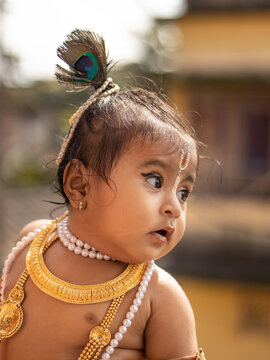 Cute baby dressed up like lord krishna/gopal in the occasion of janmashtami stock image.