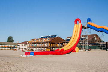 inflatable water slide on the beach