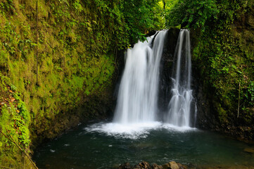 Fototapeta na wymiar Waterfall near Chato Volcano Observatory lodge in tropical rainforest