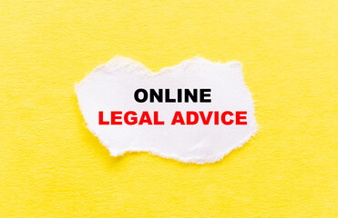 the inscription ONLINE LEGAL ADVICE on a white torn piece of paper on a yellow background