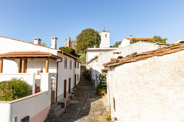 a street with typical white houses within the walls of the Citadel of Braganca (historic city center), Tras-os-Montes, Portugal