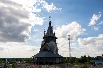 gray church built according to northern national traditions of wood and stone