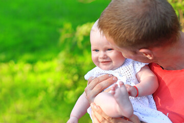 Dad and daughter in the park. Portrait of dad and child.