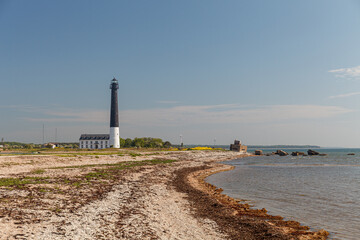 Fototapeta na wymiar High lighthouse Sorve is the most recognizable sight on Saaremaa island in Estonia