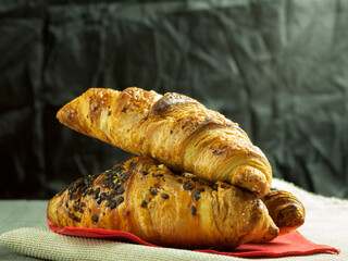 Delicious croissant with chocolate filling as background