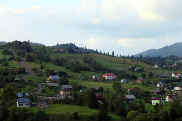 Fototapeta premium small village in the mountains in summer