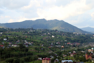 Fototapeta premium small village in the mountains in summer