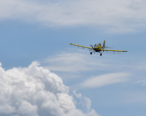 Bright Yellow Crop Duster putting on a show!