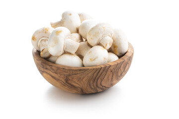 Fresh white champignon mushrooms in bowl.