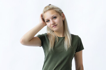 Fototapeta premium Pretty smiling joyfully female with fair hair, looking with satisfaction at camera, being happy. Beautiful woman isolated against blank studio wall.