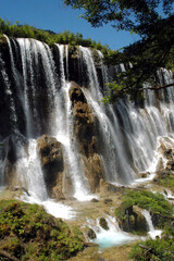 Obraz premium Juizhaigou (Nine Villages Valley) in Sichuan, China. View of Nuorilang Waterfall. Juizhaigou is a popular tourist destination in China famous for its waterfalls, lakes and scenic beauty.
