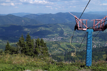 mountain lift against the backdrop of a summer mountain landscape
