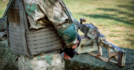 Soldier in full gear on the background of nature © Zhanna