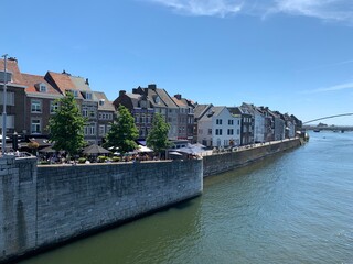 Old houses on the bank of Meuse (Maas) river. Maastricht, Limburg / Netherlands .