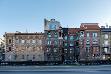 Fototapeta na wymiar Facades of residential old buildings with beautiful molding and balconies on Krakow street, Poland