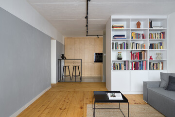 Apartment with exposed concrete and wood