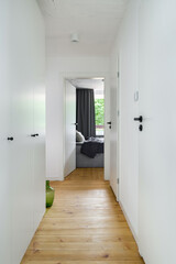 Simple white corridor with wooden floor