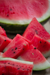 Fresh red watermelon on wooden cutting board, picnic concept, selective focus
