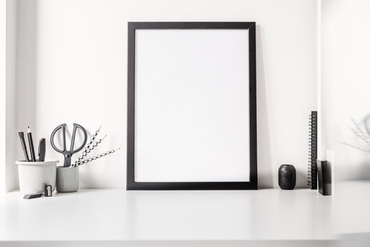 Mockup of blank black poster frame.