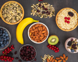 Group Fruits Breakfast with bread Whole grains and nuts, yogurt mix with Cherry , banana, avocado in the wooden table. Breakfast for Health and Diet concept