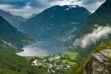 Scenic view of the Geiranger Fjord, Norway. A spectacular, narrow finger of the Sunnylvsfjorden, a branch of the Storfjorden. Geiranger village is located at the end of the fjord